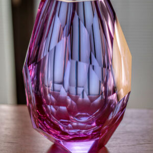 pink and purple hue crystal faceted vase hand-cut entirely by glass artisan place on top of table centrepiece