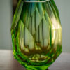 blue green faceted crystal vase place on table centrepiece