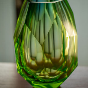 blue green faceted crystal vase place on table centrepiece